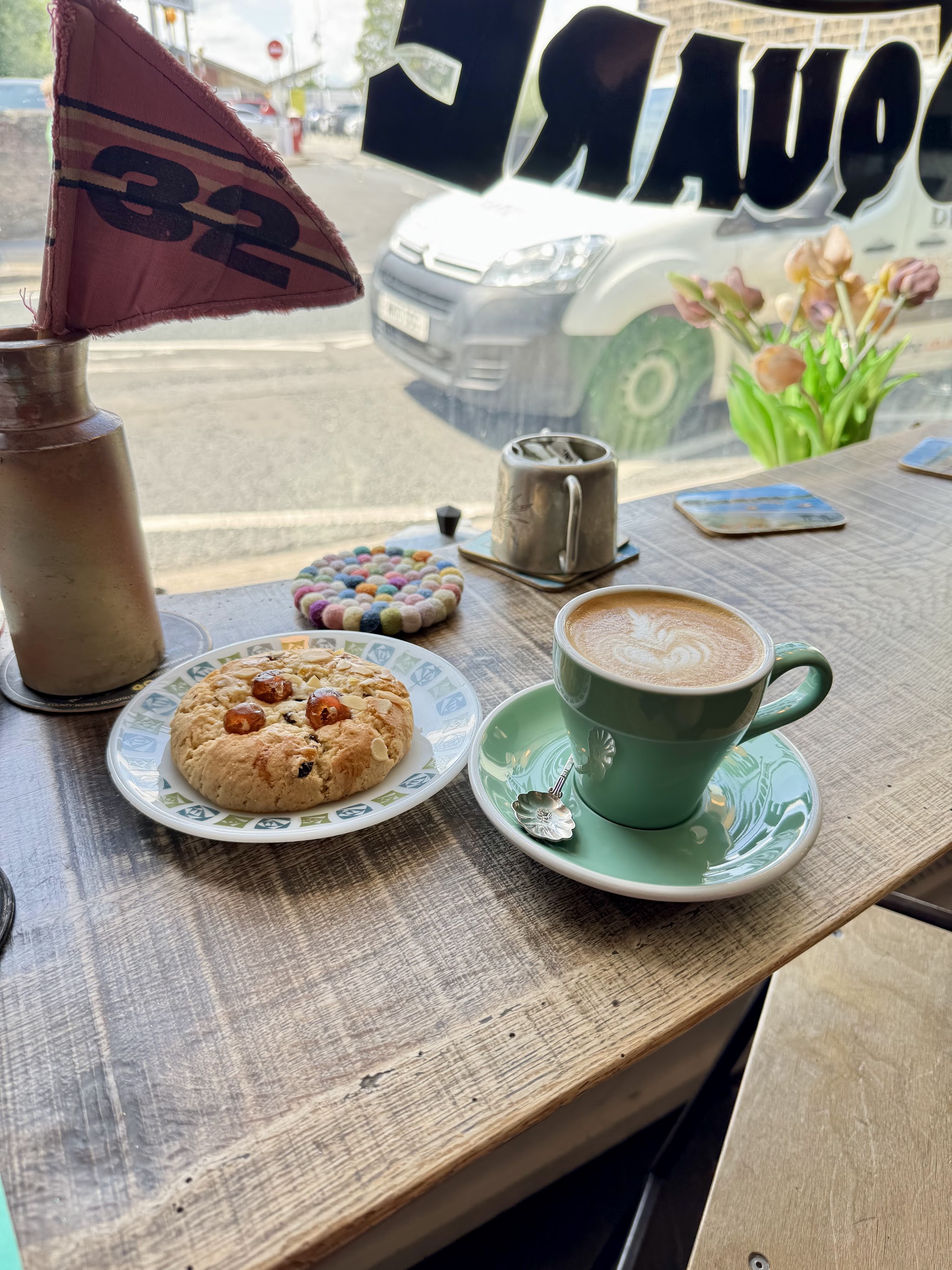Coffee and a biscuit by the Bloomfield Square window