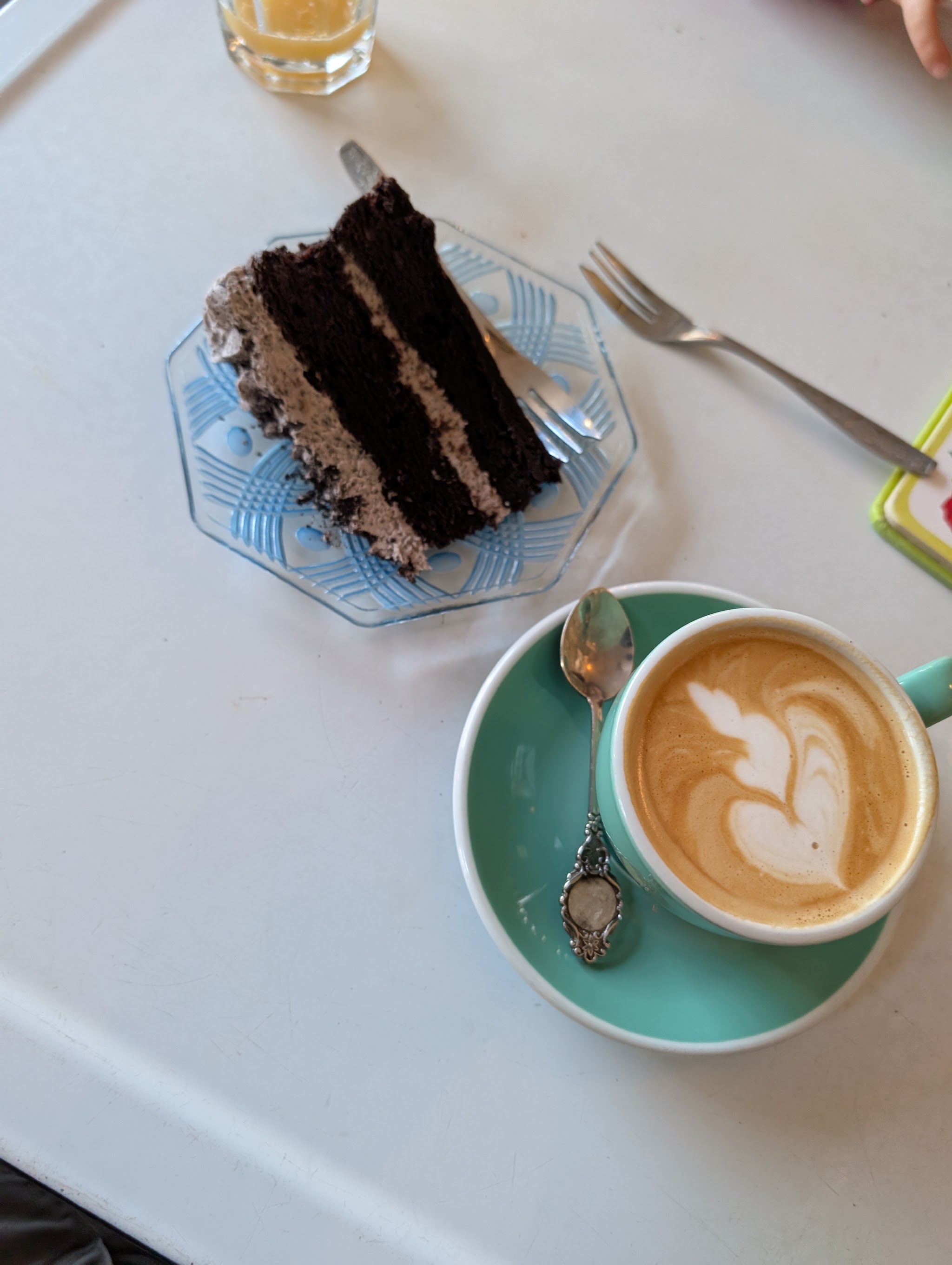 A slice of chocolate cake with a coffee at Bloomfield Square